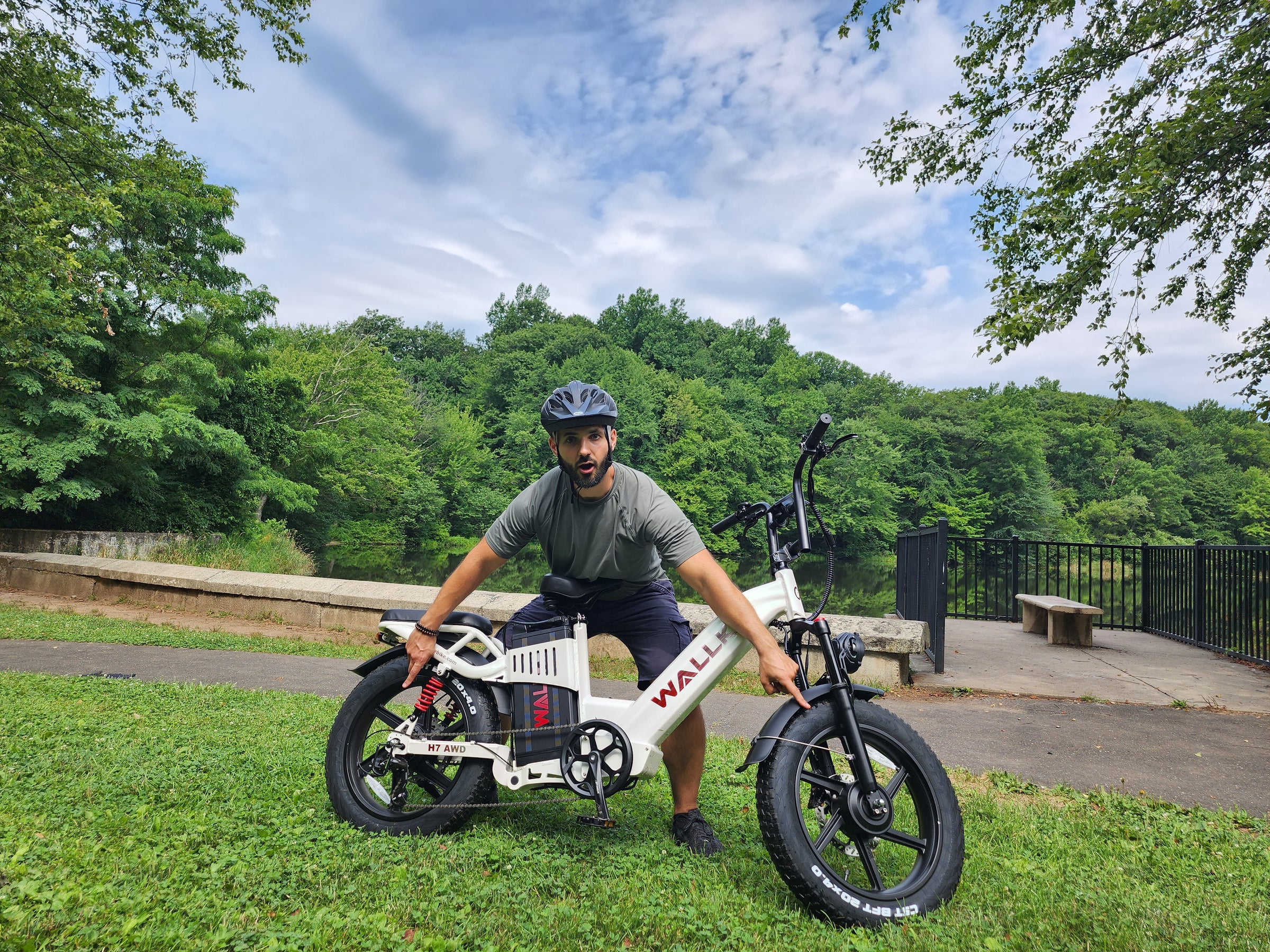 Electric bike experience riding on grassy terrain, showcasing comfort and versatility in outdoor adventures.
